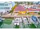 Aerial view showing property, boat slips, and waterfront location at 2600 N Paula Dr # 19A, Dunedin, FL 34698