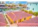 Property's yellow exterior with red tile roof, waterfront view at 2600 N Paula Dr # 19A, Dunedin, FL 34698