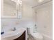 Clean bathroom with a tub, toilet and vanity at 2600 N Paula Dr # 19A, Dunedin, FL 34698