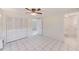 Bright bedroom with tile floors and spacious closet at 2600 N Paula Dr # 19A, Dunedin, FL 34698