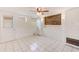 Bedroom with tile floors, ceiling fan and built-in shelving at 2600 N Paula Dr # 19A, Dunedin, FL 34698