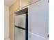 View of kitchen refrigerator and cabinets at 2600 N Paula Dr # 19A, Dunedin, FL 34698