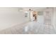 Living room with tile floors and kitchen access at 2600 N Paula Dr # 19A, Dunedin, FL 34698