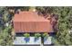 Direct overhead view of an apartment building's red roof and parking at 11511 113Th St # 13F, Seminole, FL 33778