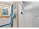 Bathroom with shower, granite vanity and blue accents at 11511 113Th St # 13F, Seminole, FL 33778