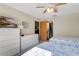 Guest bedroom with two twin beds, dresser, and TV at 11511 113Th St # 13F, Seminole, FL 33778
