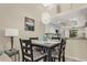 Small dining area with four chairs, adjacent to the kitchen at 11511 113Th St # 13F, Seminole, FL 33778
