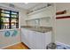 Kitchen with white cabinets, granite countertops, and open shelving at 11511 113Th St # 13F, Seminole, FL 33778