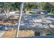 View of an apartment building's parking lot with ample spaces at 11511 113Th St # 13F, Seminole, FL 33778