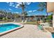 Community pool area with seating and a relaxing atmosphere at 11511 113Th St # 13F, Seminole, FL 33778
