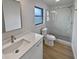 Modern bathroom with white vanity, quartz countertop, and a large walk-in shower at 2801 65Th N Way, St Petersburg, FL 33710