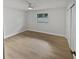 Bright bedroom with wood-look floors and white walls at 2801 65Th N Way, St Petersburg, FL 33710