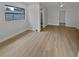 Spacious bedroom with wood-look floors and bathroom access at 2801 65Th N Way, St Petersburg, FL 33710