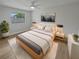 Spacious bedroom with light walls, a large bed, and a modern dresser at 2801 65Th N Way, St Petersburg, FL 33710