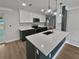 Modern kitchen with dark green cabinets, white countertops, and gold fixtures at 2801 65Th N Way, St Petersburg, FL 33710