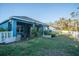 Spacious backyard with a grassy lawn and white fence at 3514 Shimmering Oaks Dr, Parrish, FL 34219