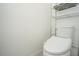 Small bathroom with toilet and shelving at 3514 Shimmering Oaks Dr, Parrish, FL 34219