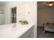Bathroom with vanity, sink, and view into bedroom at 3514 Shimmering Oaks Dr, Parrish, FL 34219