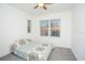 Bedroom with a patterned bedspread and a window with blinds at 3514 Shimmering Oaks Dr, Parrish, FL 34219