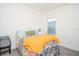 Bedroom with patterned bedspread and yellow knit throw at 3514 Shimmering Oaks Dr, Parrish, FL 34219