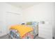 Bedroom with patterned bedspread and white dresser at 3514 Shimmering Oaks Dr, Parrish, FL 34219