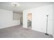 Main bedroom with ensuite bathroom and floor lamp at 3514 Shimmering Oaks Dr, Parrish, FL 34219