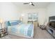 King-size bed, TV, and ample space for relaxation at 3514 Shimmering Oaks Dr, Parrish, FL 34219