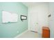 Inviting entryway with teal walls and white door at 3514 Shimmering Oaks Dr, Parrish, FL 34219