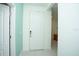Bright entryway with white door and light teal walls at 3514 Shimmering Oaks Dr, Parrish, FL 34219