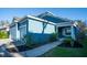 Blue house with a two-car garage and walkway at 3514 Shimmering Oaks Dr, Parrish, FL 34219