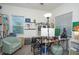 Bright home office features built-in shelving and a comfortable chair at 3514 Shimmering Oaks Dr, Parrish, FL 34219