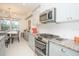 Modern kitchen with stainless steel appliances and granite countertops at 3514 Shimmering Oaks Dr, Parrish, FL 34219