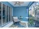 Relaxing screened porch with seating area and sliding glass doors at 3514 Shimmering Oaks Dr, Parrish, FL 34219