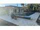 Backyard pool with travertine deck and pergola at 431 Island Cir, Sarasota, FL 34242