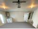 Garage with painted floor and automatic garage door opener at 4406 Woodtrail Blvd, New Port Richey, FL 34653