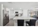 Bright kitchen with stainless steel appliances and a large island at 4406 Woodtrail Blvd, New Port Richey, FL 34653
