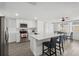 Modern kitchen featuring white cabinets, quartz countertops, and stainless steel appliances at 4406 Woodtrail Blvd, New Port Richey, FL 34653