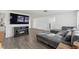 Spacious living room with L-shaped sectional sofa and modern fireplace at 4406 Woodtrail Blvd, New Port Richey, FL 34653