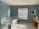 Bathroom features a soaking tub, glass shower, and dual sinks at 25737 Frith St, Land O Lakes, FL 34639