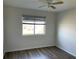 Bright bedroom with ceiling fan and wood-look floors at 25737 Frith St, Land O Lakes, FL 34639