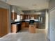 Kitchen boasts an island, stainless steel appliances, and wood cabinets at 25737 Frith St, Land O Lakes, FL 34639