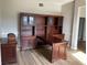 Home office with built-in wood desk and shelving at 25737 Frith St, Land O Lakes, FL 34639