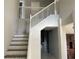 Staircase with white railing and wooden steps at 25737 Frith St, Land O Lakes, FL 34639