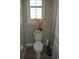 Convenient powder room with decorative touches at 32026 Wenlock Loop, Wesley Chapel, FL 33543