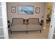 Elegant sitting area with a cozy sofa and artwork at 32026 Wenlock Loop, Wesley Chapel, FL 33543