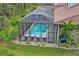 Aerial view of the house and the backyard with a pool at 9044 Luna Ln, Sarasota, FL 34241