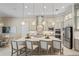 Large kitchen with white cabinets, quartz countertops and stainless steel appliances at 9044 Luna Ln, Sarasota, FL 34241