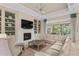 Light and airy living room with a fireplace and access to backyard at 9044 Luna Ln, Sarasota, FL 34241