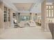 Open living room with large sectional sofa and built in shelving at 9044 Luna Ln, Sarasota, FL 34241