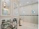 Luxurious Primary bathroom with a large walk-in shower and double vanity at 9044 Luna Ln, Sarasota, FL 34241